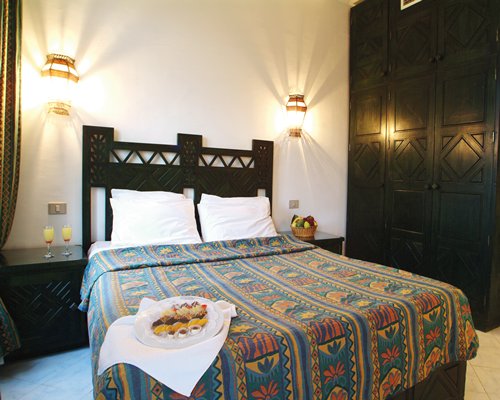A well furnished bedroom with wardrobe.
