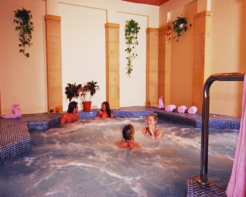 View of people inside the indoor hot tub.