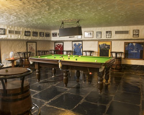 Indoor recreation room with a pool table.