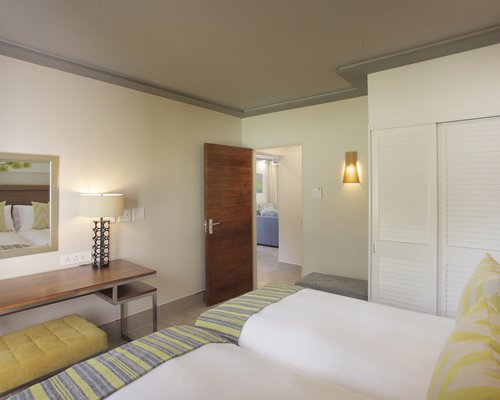 A well furnished bedroom with bathroom.