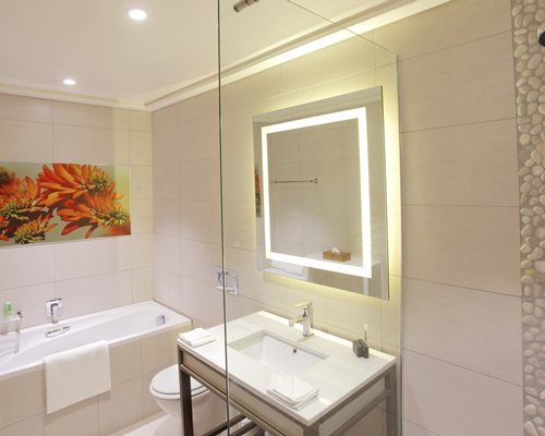 A well furnished bedroom with two twin beds.