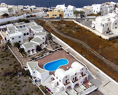 An aerial view of Laokasti Villas with outdoor swimming pool alongside the sea.