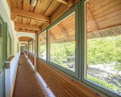 A balcony and landscaped pathway at Club Dobogomajor.