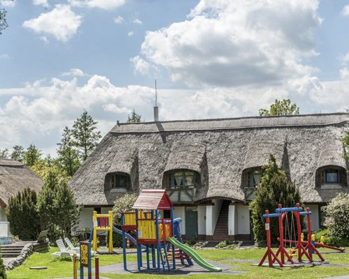 An outdoor kids playscape alongside the resort unit.