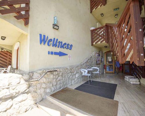 Interior view of a unit with wooden stairway at Club Dobogomajor.