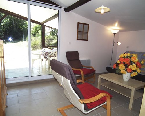 A well furnished living room with a patio.