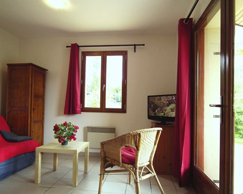 A well furnished bedroom with an outside view.