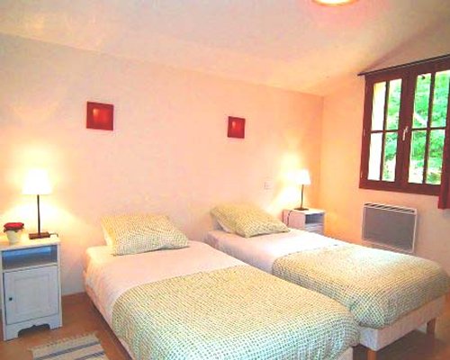 A well furnished bedroom with two beds.