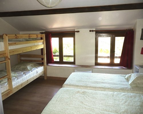 A furnished bedroom with two single beds.