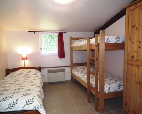 Furnished bedroom with two twin bunk beds.