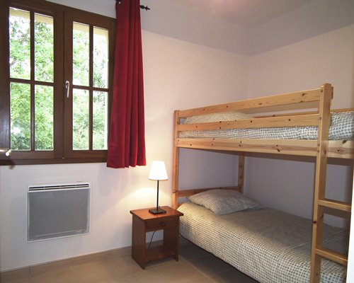 A bedroom with two twin beds.