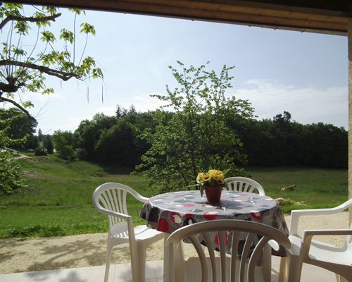 Balcony with patio chairs.