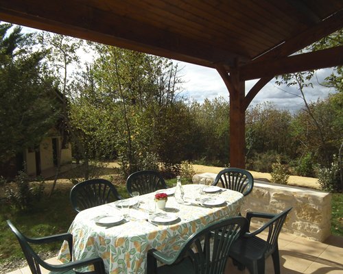 An outdoor dining area with patio furniture.
