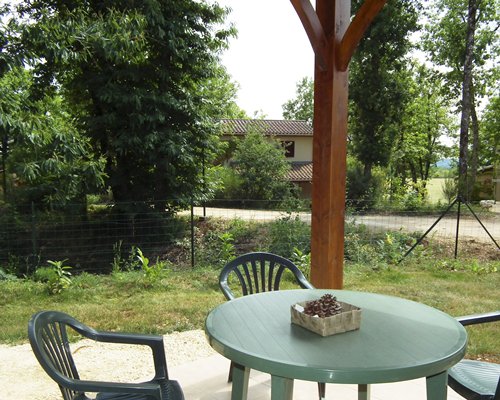 An outdoor dining area with patio furniture.