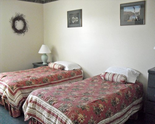 A well furnished bedroom with multiple twin beds.
