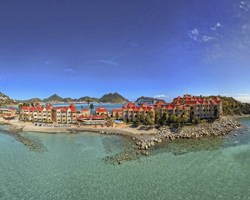 An aerial view of the resort properties alongside the beach.