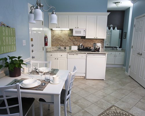 A well equipped kitchen with a dining area.