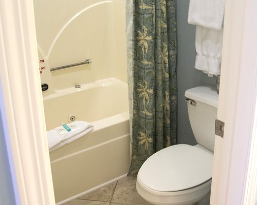 A bathroom with a bathtub and shower.