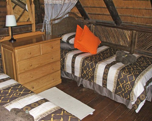 A well furnished bedroom with two beds.
