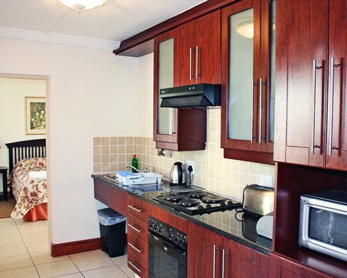 A well equipped kitchen alongside the bedroom.
