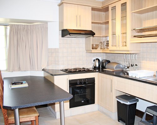 An open plan kitchen with dining area.
