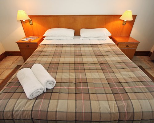 A well furnished bedroom with a king bed.