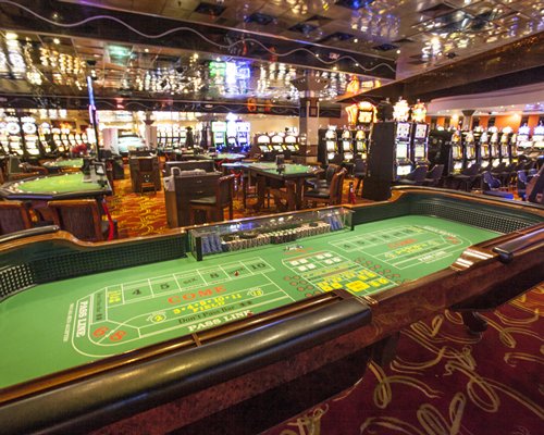 Indoor recreation room with casino tables.