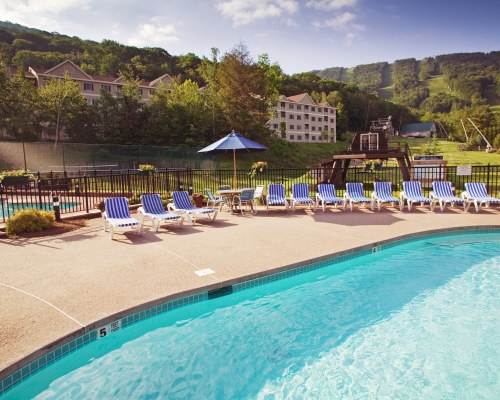 OUTDOOR SWIMMING POOLS NEAR UNITS AT WYNDHAM BENTLEY BROOK.