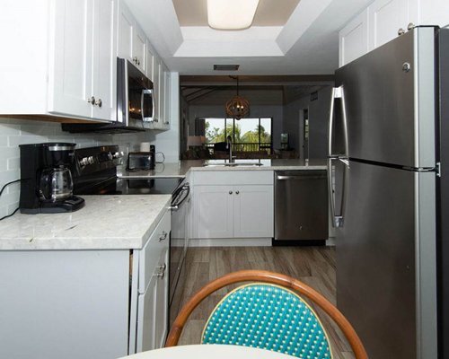 An open plan kitchen with dining area and living room.