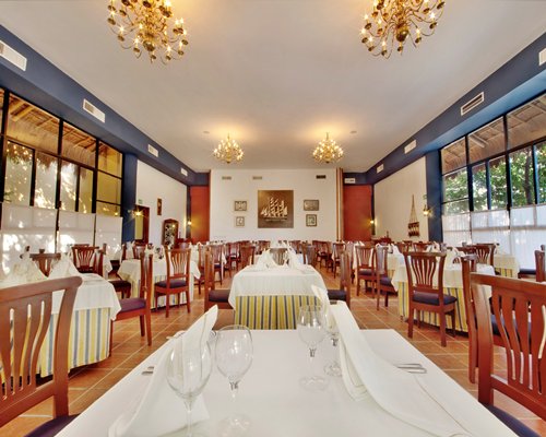 An indoor fine dining restaurant with multiple dining tables.