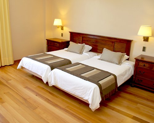 A well furnished bedroom with twin beds.