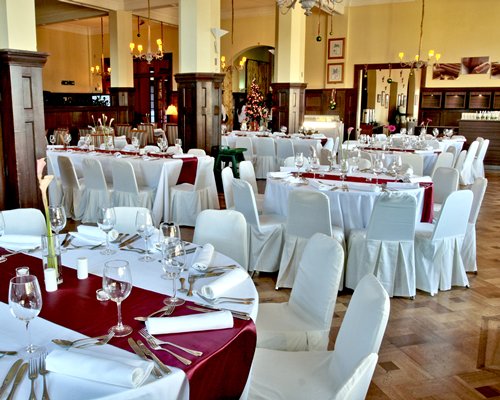 An indoor fine dining restaurant with multiple dining tables.