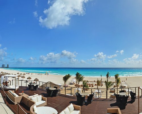 An outdoor lounge area alongside the beach.