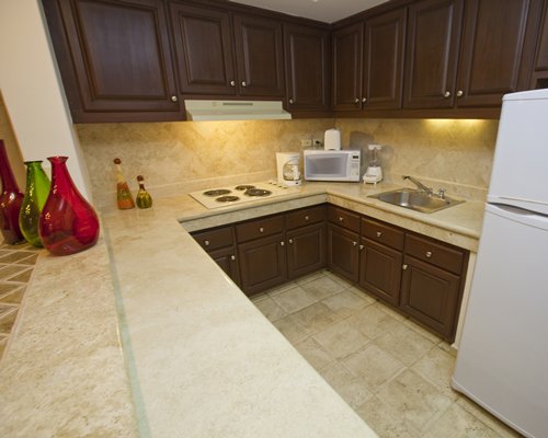 A well equipped kitchen with a microwave oven.