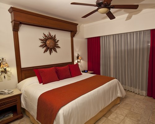 A well furnished bedroom with a king bed.