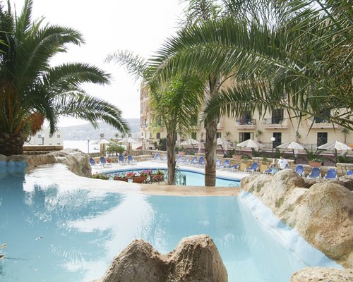 Large outdoor swimming pool overlooking the sea.
