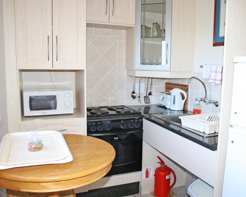 A well equipped open plan kitchen with dining area.
