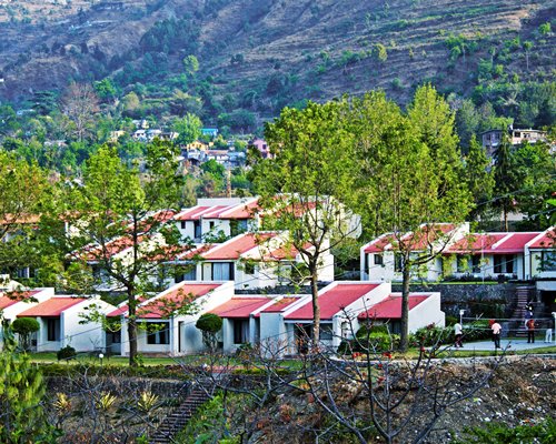 Scenic exterior view of Country Inn Bhimtal resort.