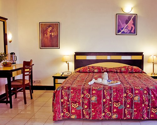 A well furnished bedroom with a double bed.