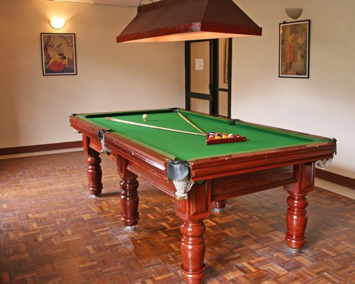 Indoor recreation room with pool table.