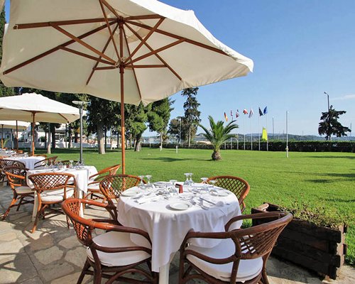 An outdoor fine dining restaurant with trees.