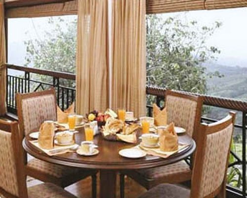 An outdoor dining area with an outside view.