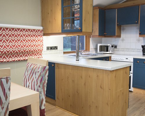 An open plan living and dining area with a microwave.