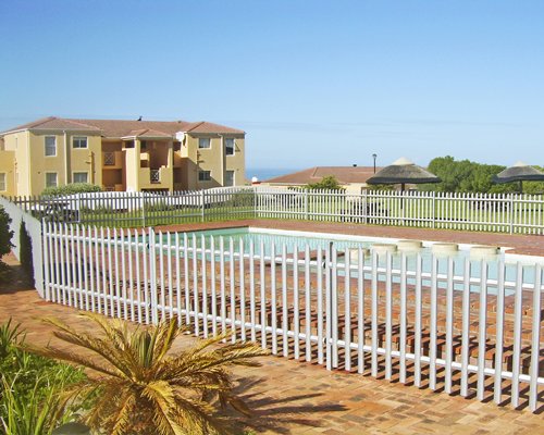 Outdoor swimming pool with picnic area.