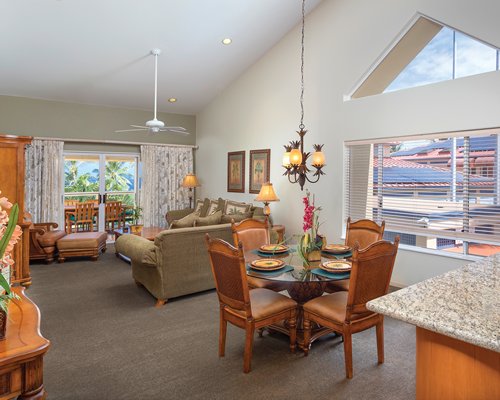 An open plan living and dining area with a balcony.