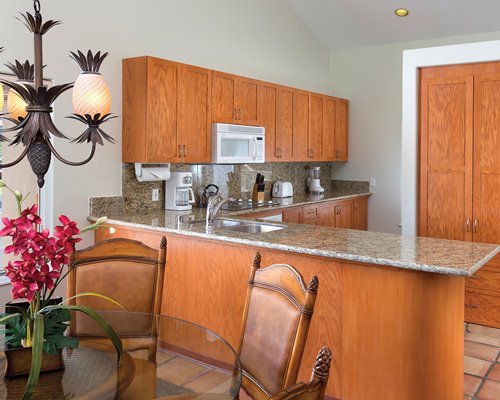 A well equipped kitchen with dining area.