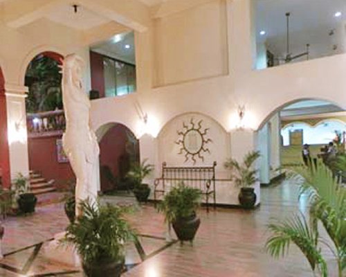 Interior view of the entrance with stairway at The Pride Sun Village Resort.