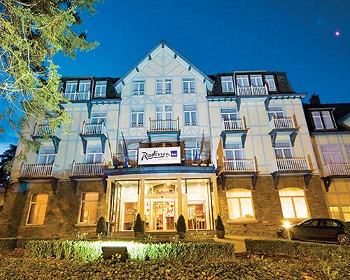 Exterior view of Balmoral resort at night.