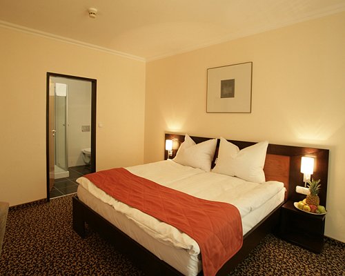 A well furnished bedroom with bathroom.