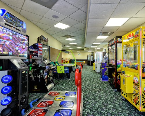 An indoor recreational room with arcade games.